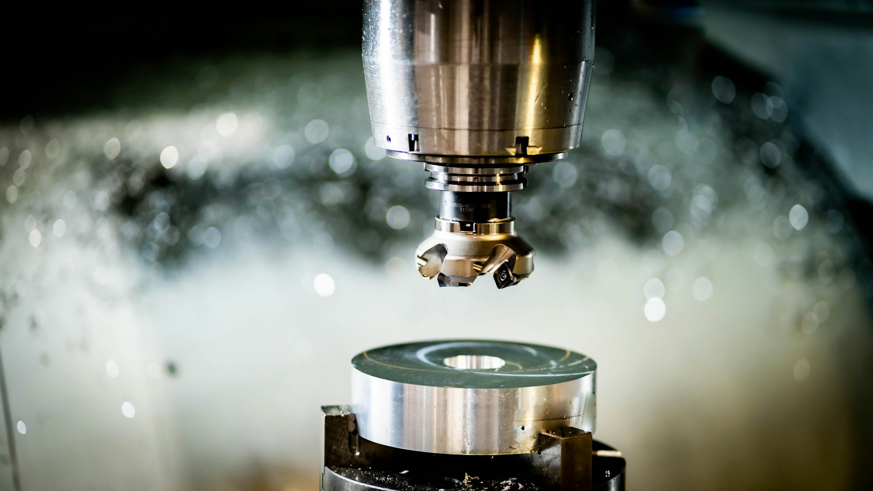 CNC machine cutting a precision metal component